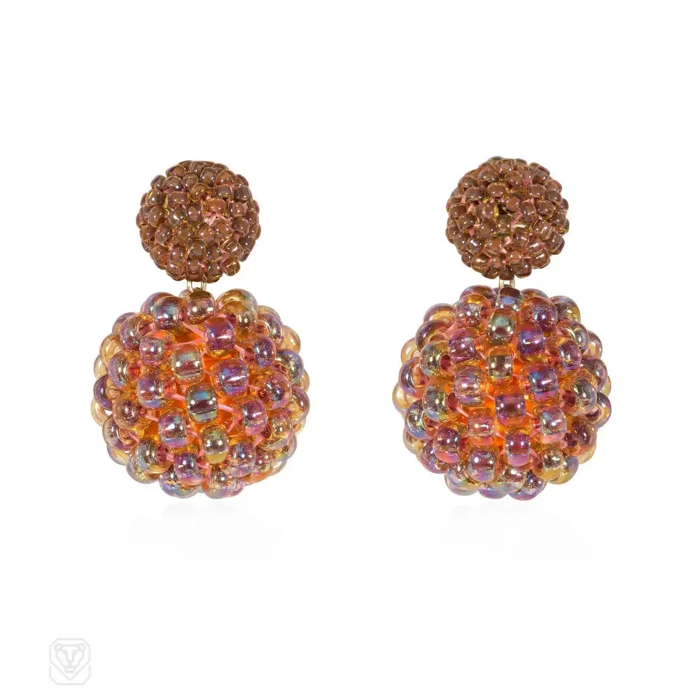 A pair of handmade glass beaded double ball earrings compris...