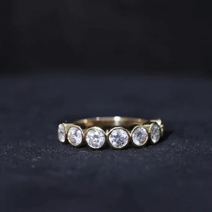 Round Moissanite Half Eternity Ring in Bezel Setting