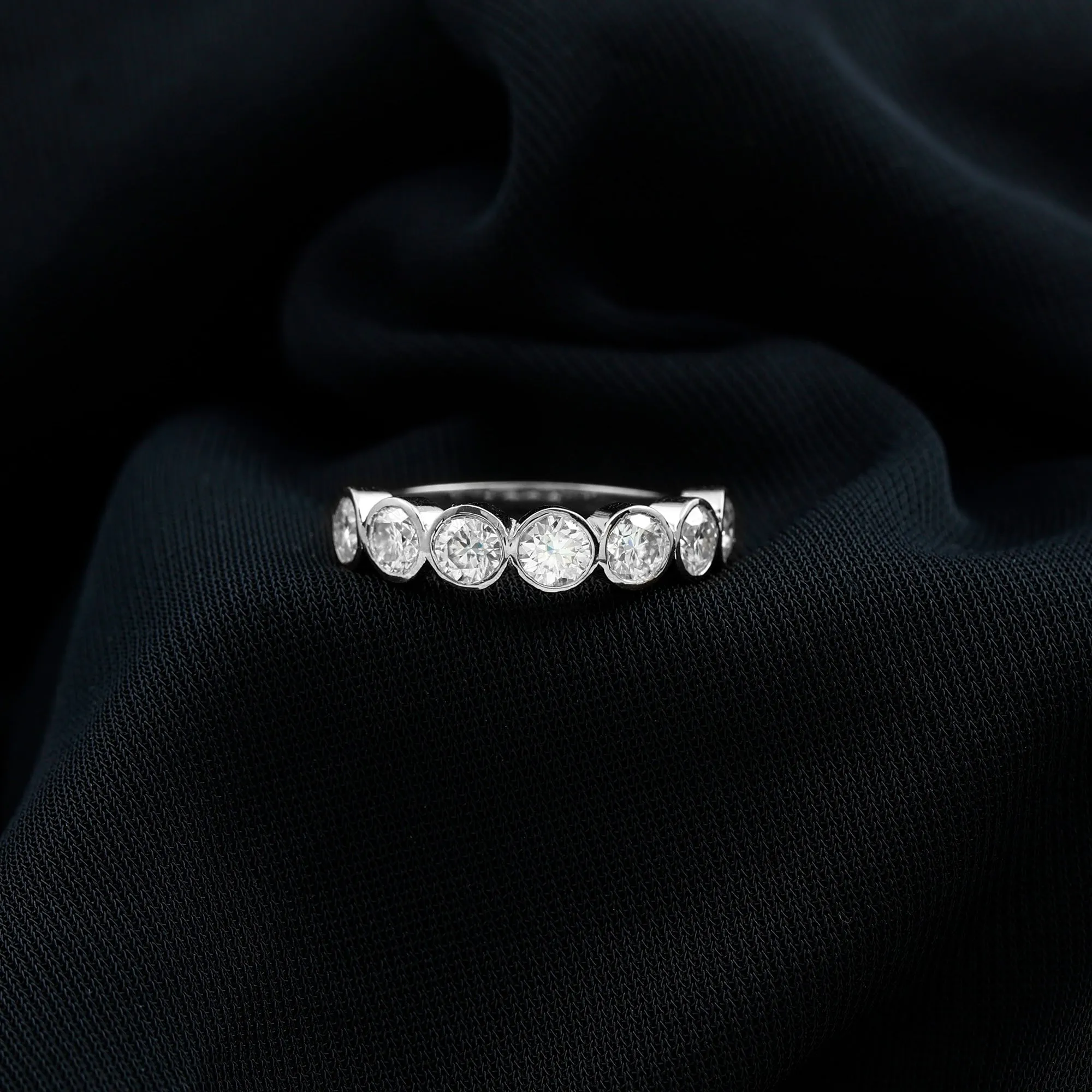 Round Moissanite Half Eternity Ring in Bezel Setting